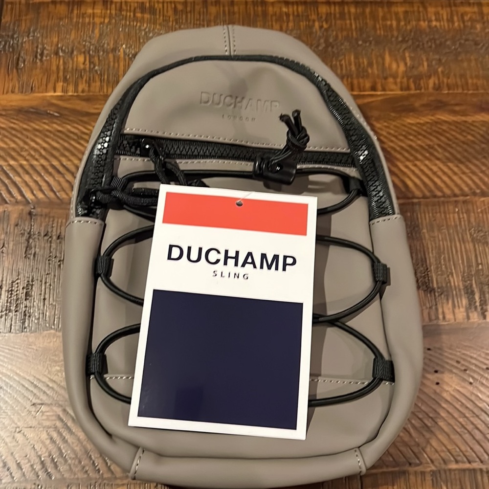 NEW🔥DUCHAMP Rubberized Sling Bag in taupe